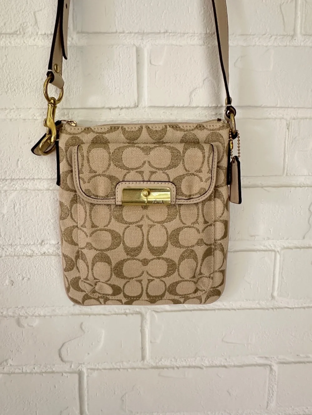 Coach Kristin Signature Crossbody Swing Bag in a metallic gold and beige fabric